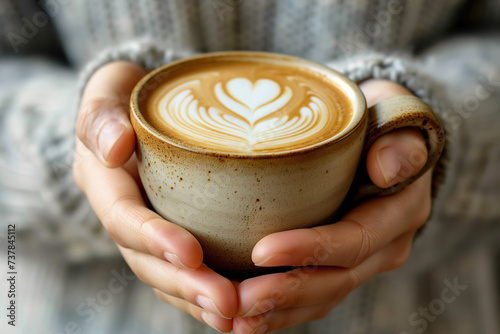 Two hands holding a cup of hot beverage. Delicious freshly brewed coffee. Created with Generative AI technology