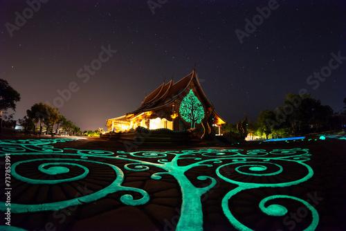 Night View of Wat Sirindhorn Wararam Phu Prao, Glow in the Dark Temple, Ubon Ratchathani, Thailand photo