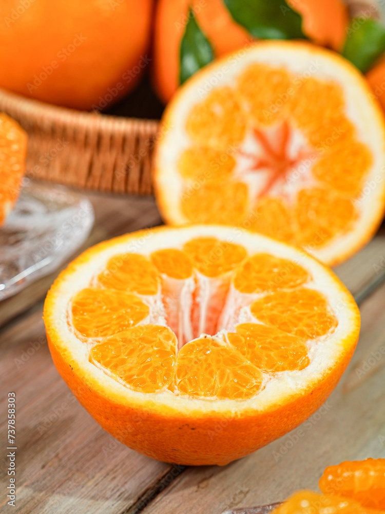 Chinese orange variety (Citrus reticulata 'Chun Jian' or papagan), close-up on tabletop indoors Chinese orange variety (Citrus reticulata 'Chun Jian' or papagan), close-up on tabletop indoors