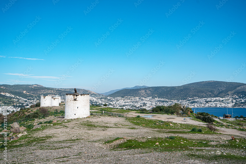 The windmills of Bodrum are a collection of stone buildings that were constructed in the 18th century and were used to grind grain into flour located on the hills between Bodrum and Gumbet, Yalikavak The windmills of Bodrum are a collection of stone buildings that were constructed in the 18th century and were used to grind grain into flour located on the hills between Bodrum and Gumbet, Yalikavak