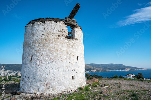 The windmills of Bodrum are a collection of stone buildings that were constructed in the 18th century and were used to grind grain into flour located on the hills between Bodrum and Gumbet,  Yalikavak photo