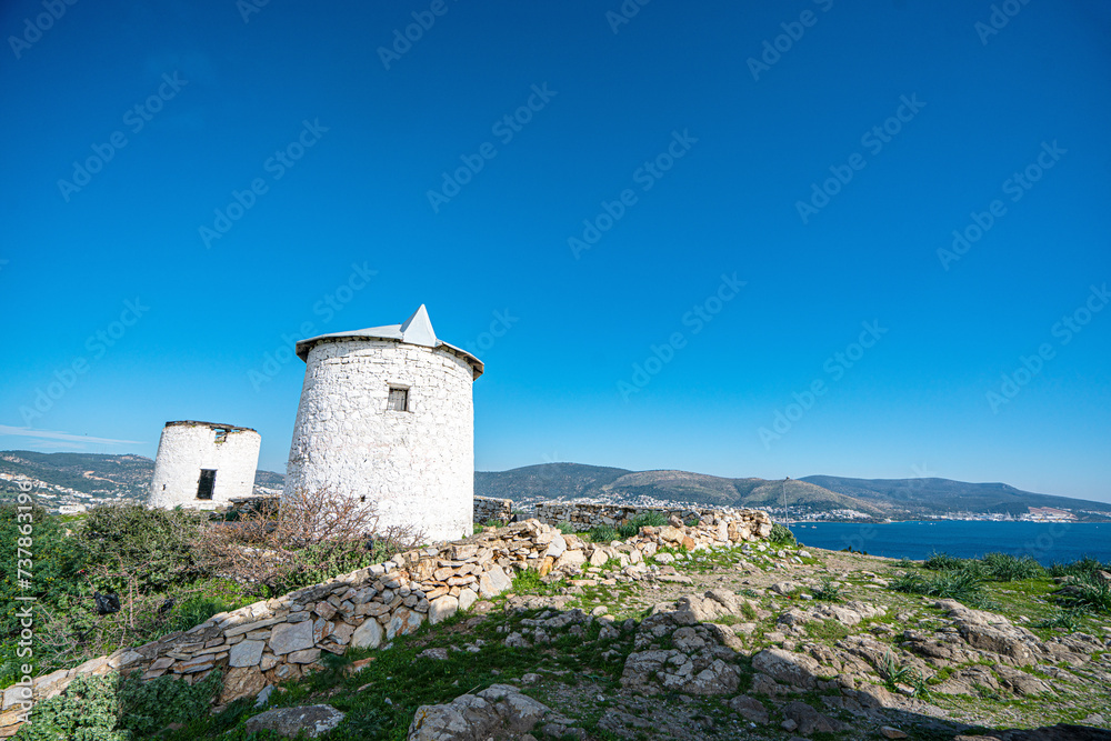 The windmills of Bodrum are a collection of stone buildings that were constructed in the 18th century and were used to grind grain into flour located on the hills between Bodrum and Gumbet,  Yalikavak