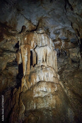 A wild cave inside. Stalactites and stalagmites. Speleology and surveys © Fotoproff