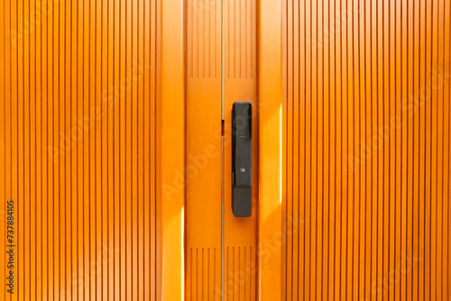 Digital door lock on wooden door