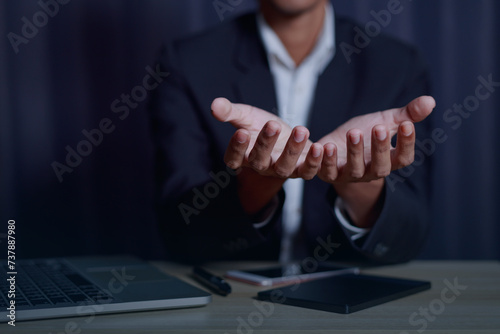 Businessman doing web conference and showing open hand gesture In the business office..