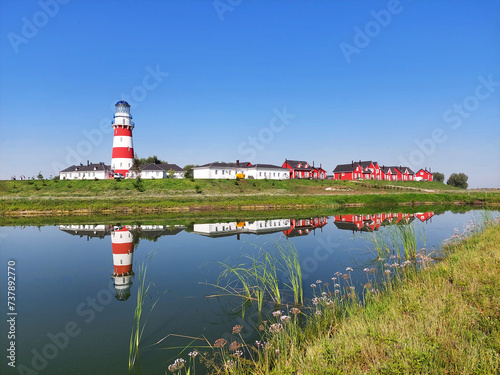 A lighthouse in the Scandinavian style. Rybatskaya Village Hotel in Ryazan region, Russia. Summer landscape, a landmark of Ryazan. photo