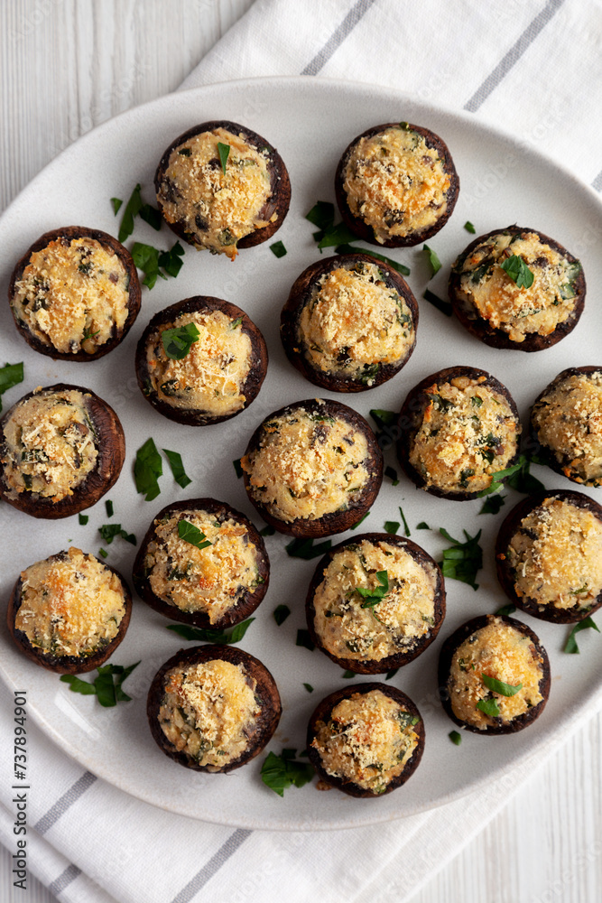 Homemade Garlic Parmesan-Stuffed Mushrooms on a plate, top view. Flat lay, overhead, from above.