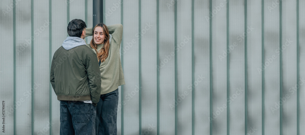 young couple talking on the street with copy space young couple talking on the street with copy space