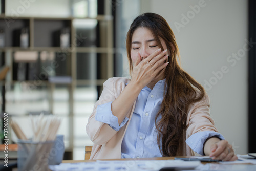 Asian businesswoman are stressed and tired from work at desk in the office, feeling sick at work, stress from work.