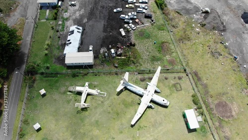 Abandoned planes at pearls airport in grenada, overgrown with vegetation, aerial view
