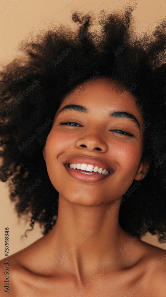 Close up portrait of a beautiful young african american woman smiling Close up portrait of a beautiful young african american woman smiling