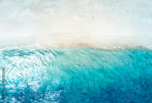 Tropical beach with white sand and turquoise ocean water, aerial view © Robert Kiyosaki