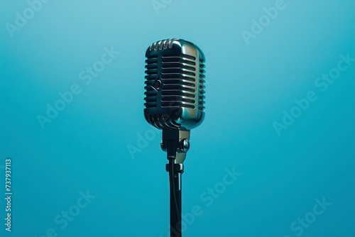Vintage microphone, light blue background.