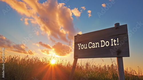 Motivational poster with the text "You Can Do It!", against a backdrop of a sunrise symbolizing new beginnings and opportunities