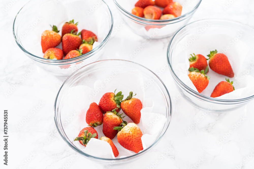 Washed and Dried Strawberries Neatly Stored in a Glass Bowl Washed and Dried Strawberries Neatly Stored in a Glass Bowl