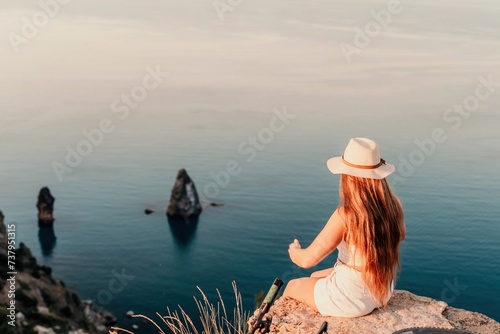 Portrait of a happy woman in a cap with long hair against the sea