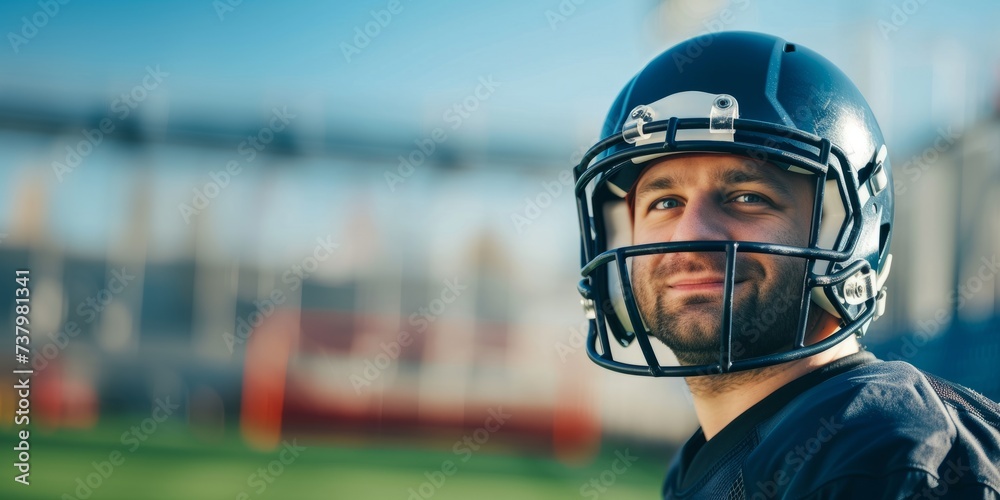 american football player holding ball