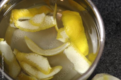 Lemon skin in pan with water. Directly above.
