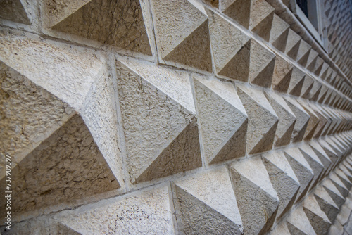 Ferrara, Emilia Romagna, Italy. A detail of the Diamond Palace with its characteristic external walls, composed of ashlar, marble blocks in the shape of diamond tips, which give the palace its name. photo