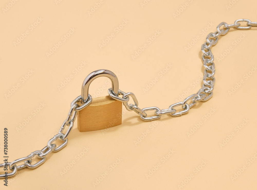 Gold lock and chain. Security and copy space for text. Gold lock and chain. Security and copy space for text.