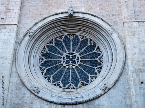 detail of the rose window of Medieval Cathedral of San Vigilio Dome Gothic style, Trento , Italy