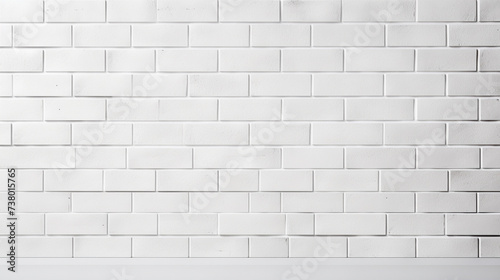 a white brick wall with a black fire hydrant