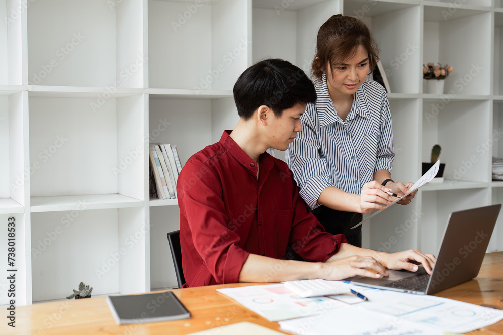 Cheerful business lady working on laptop in office, Asian happy beautiful businesswoman in formal suit work in workplace Cheerful business lady working on laptop in office, Asian happy beautiful businesswoman in formal suit work in workplace