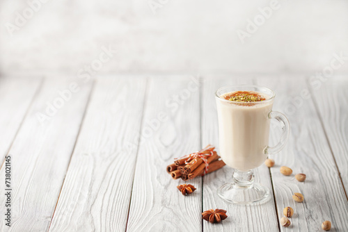 Turkish traditional hot drink salep on white wooden background. Copy space photo