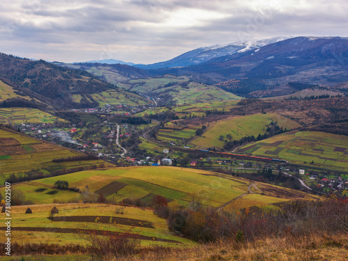 mountainous rural landscape of ukraine in autumn. remote village in the valley. transcarpathian countryside scenery in fall season on an overcast day