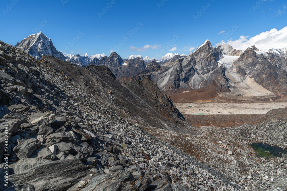 Alpine lake, Mounts Cholatse, Lobuche, Cho Oyu and Khumbu Glacier from Kongma La Pass during Everest Base Camp EBC or Three Passes trekking in Khumjung, Nepal. Highest mountains in the world.