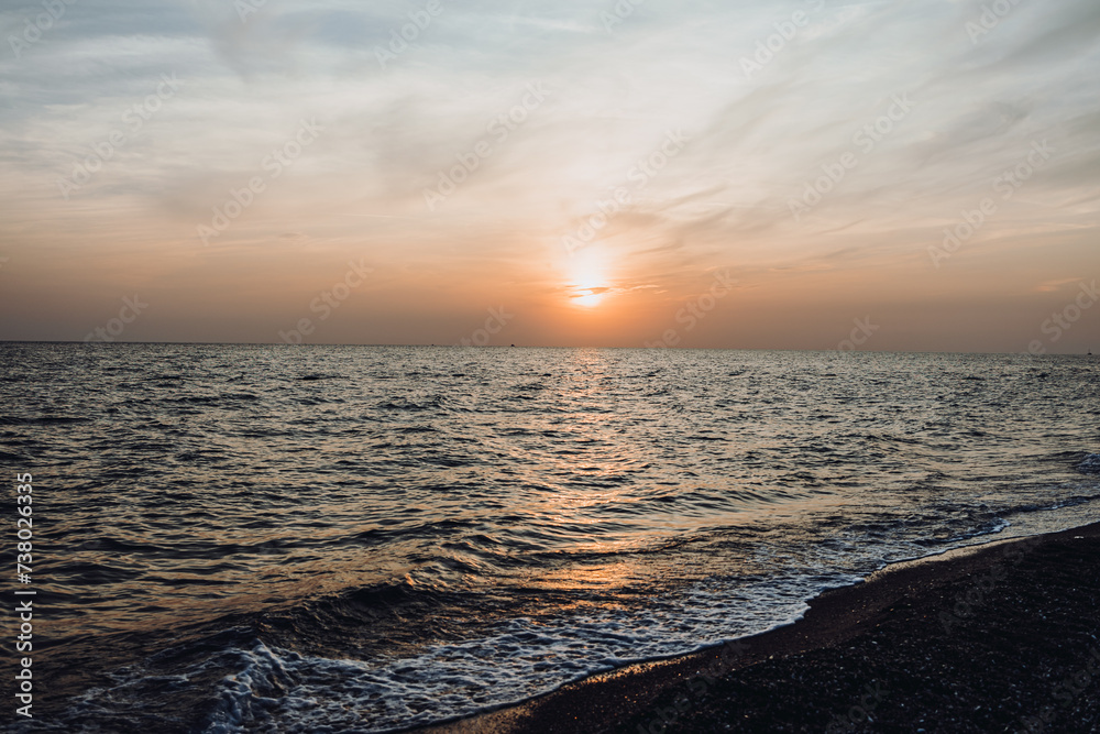 Obraz premium beautiful evening landscape on the sea. sunset of the setting sun. the sun disappeared behind the horizon of the sea.Turkey Mediterranean Sea