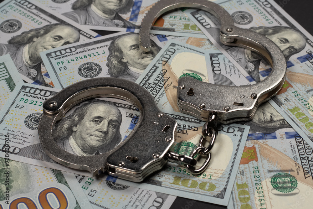 Φωτογραφία American dollars and handcuffs, Concept of ideas of corruption, dirty money or f