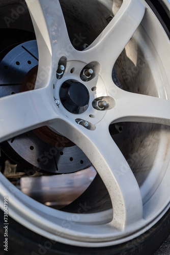 Close up of sports car alloy wheel. Tuning parts.