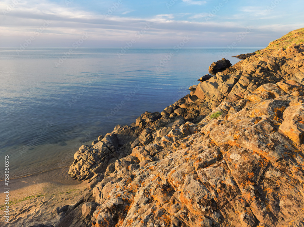 Rocky Black Sea coast in the rays of the setting sun, Sinemorets, Bulgaria