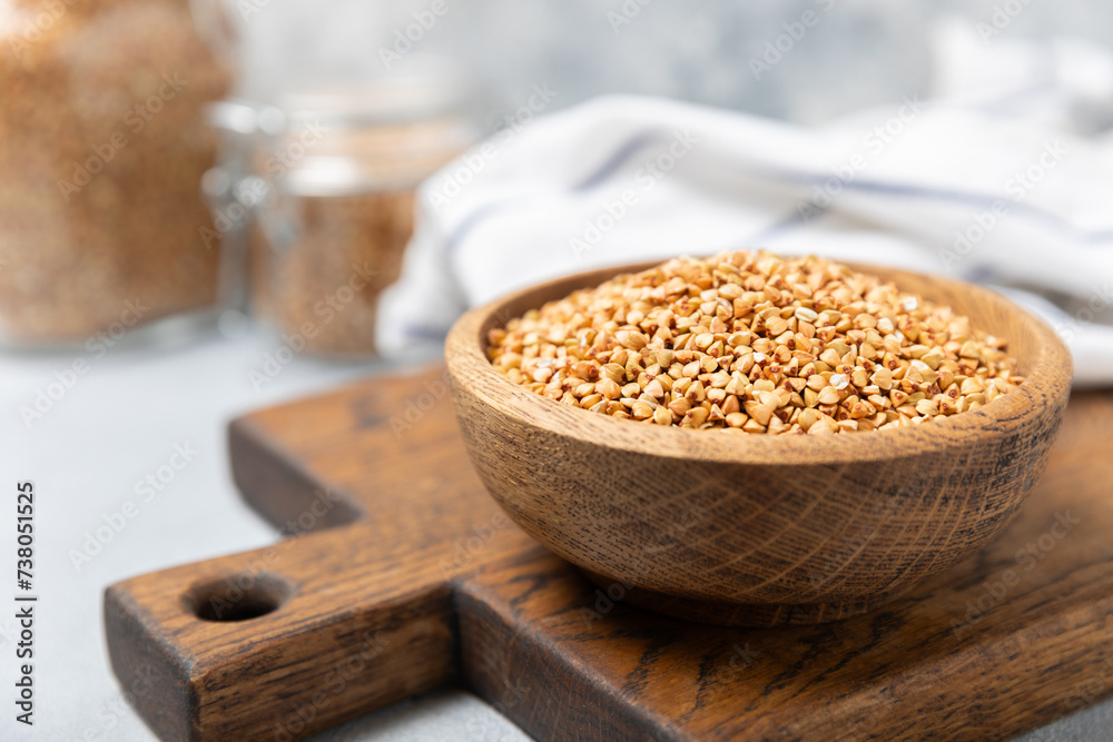 Green buckwheat in a bowl on a wooden kitchen table.Superfood.Raw buckwheat porridge.Healthy vegan food concept, eco products, diet. Copy space.Organic food.weight loss and proper nutrition. Green buckwheat in a bowl on a wooden kitchen table.Superfood.Raw buckwheat porridge.Healthy vegan food concept, eco products, diet. Copy space.Organic food.weight loss and proper nutrition.