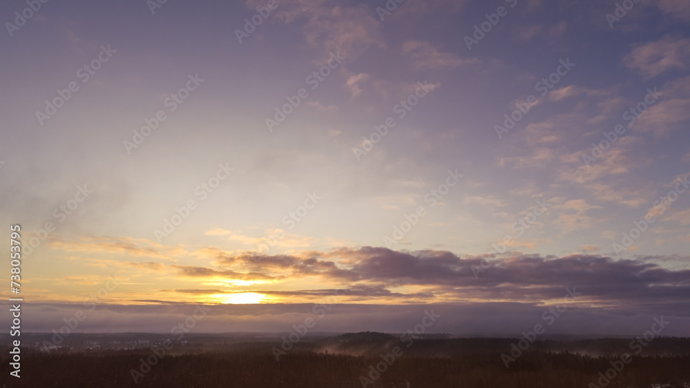 Aerial view of beautiful sunset sky over forest