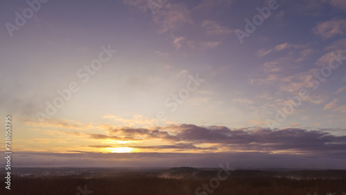 Aerial view of beautiful sunset sky over forest © imagesbystefan