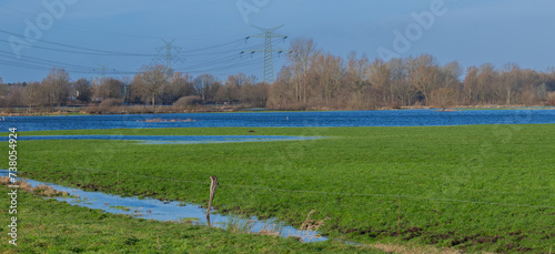 Überschwemmungsgebiet bei Pinneberg Wiesen stehen vom Dauerregen unter Wasser photo