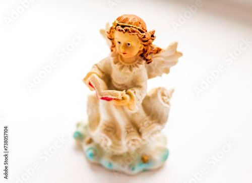 Concept shot of a little angel figurine. Religion