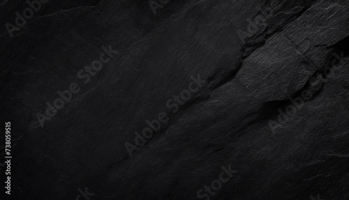 A close-up of dark, rugged rock textures, highlighting the intricate patterns and deep shadows, Ideal for backgrounds, nature themes, or abstract art.