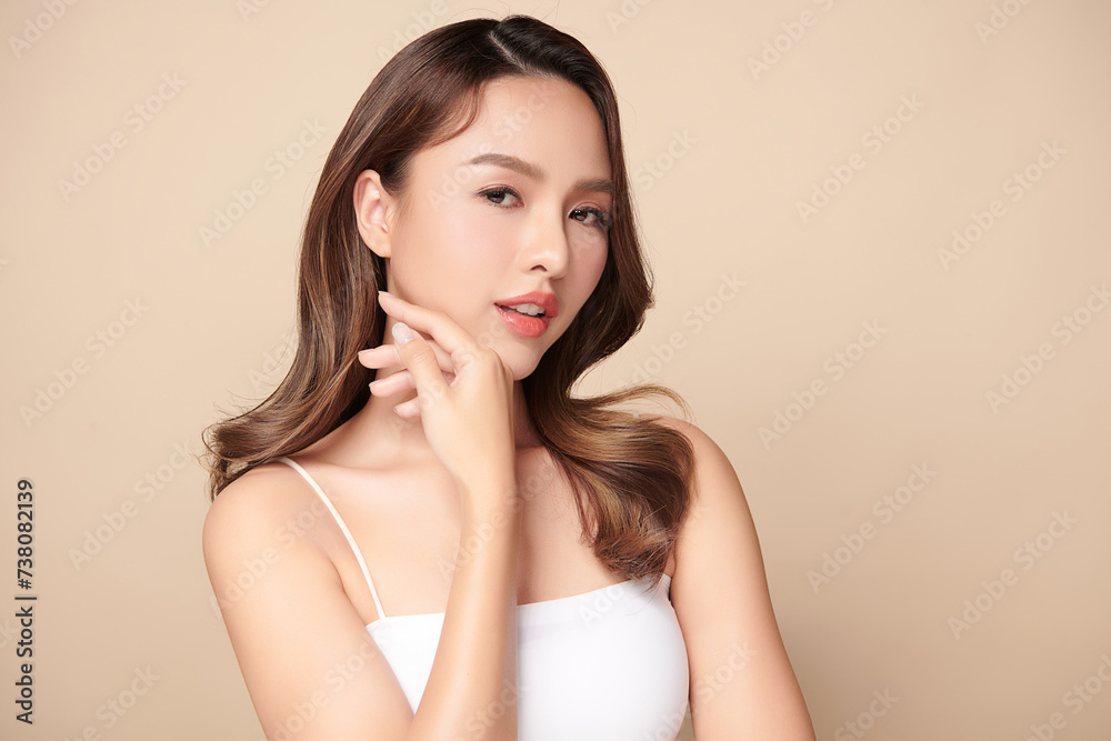 Beautiful young asian woman with clean fresh skin on beige background, Face care, Facial treatment, Cosmetology, beauty and spa, Asian women portrait. Beautiful young asian woman with clean fresh skin on beige background, Face care, Facial treatment, Cosmetology, beauty and spa, Asian women portrait.