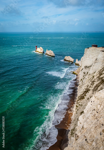 Vertical view with Isle of Wight Needles on cloudy morning in summer