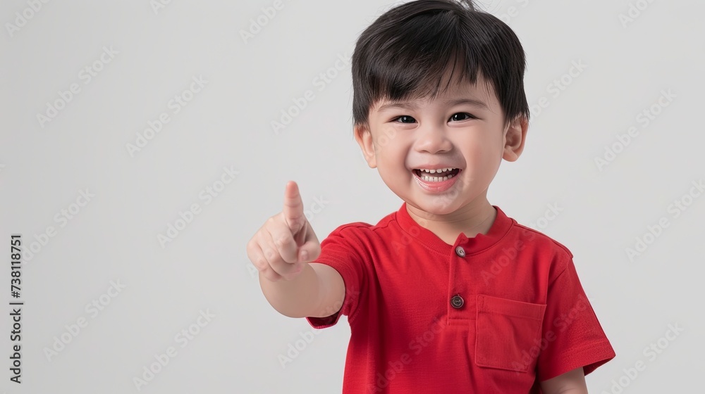 Smiling Boy in Red Shirt Pointing Forward
A charming young boy in a bright red shirt is pointing forward with a cheerful smile, set against a soft white background.
Smiling Boy in Red Shirt Pointing Forward
A charming young boy in a bright red shirt is pointing forward with a cheerful smile, set against a soft white background.