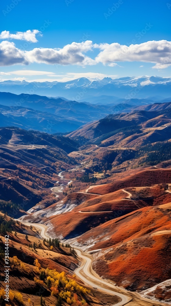 Colorful mountain landscape with a road winding through it
