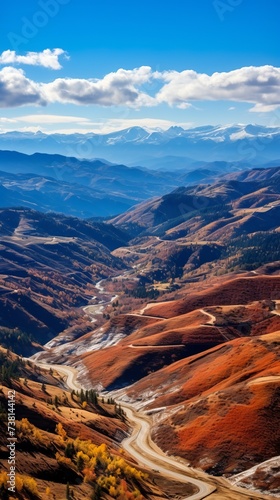 Colorful mountain landscape with a road winding through it
