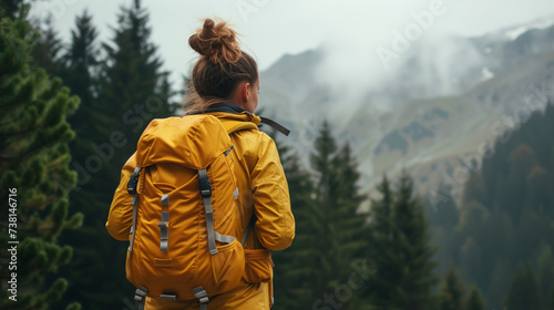 Woman enjoying hike on sunny vacation day. Female with backpack walking through forest path or lake view. Spending summer vacation close to nature. with forest green woods around. Woman enjoying hike.