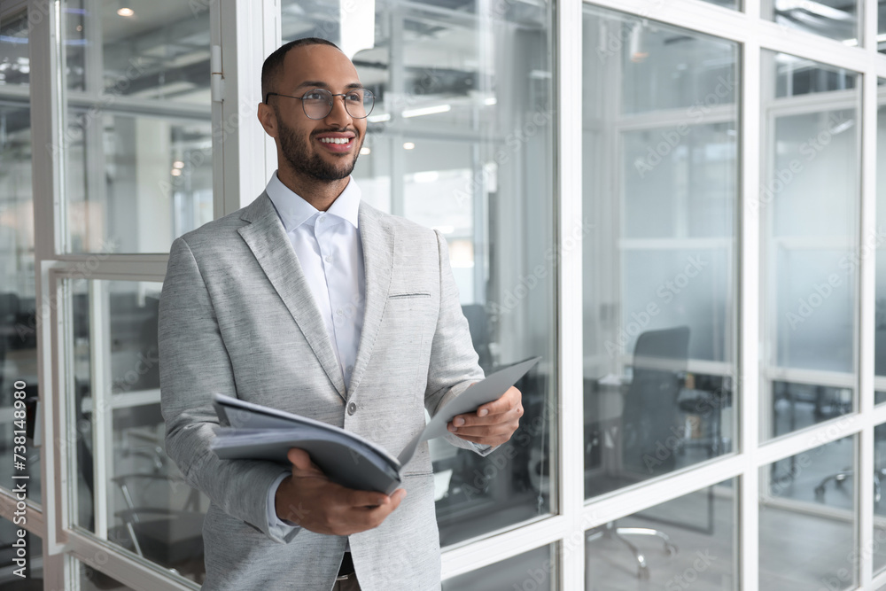 Fototapeta premium Happy man with folders in office, space for text. Lawyer, businessman, accountant or manager
