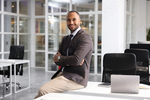 Happy man with crossed arms in office. Lawyer, businessman, accountant or manager