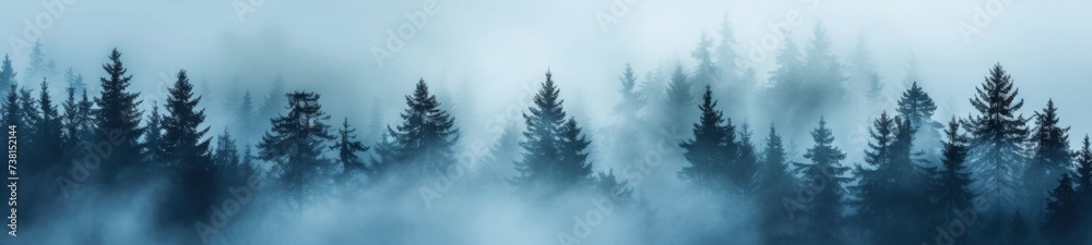 A pine forest enveloped in an ethereal fog in blue undertone - obrazy, fototapety, plakaty 