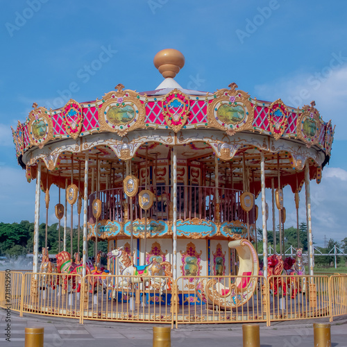 a carousel that has deserted visitors in a park